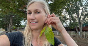 kim byrne wearing scrub oak leaf earrings