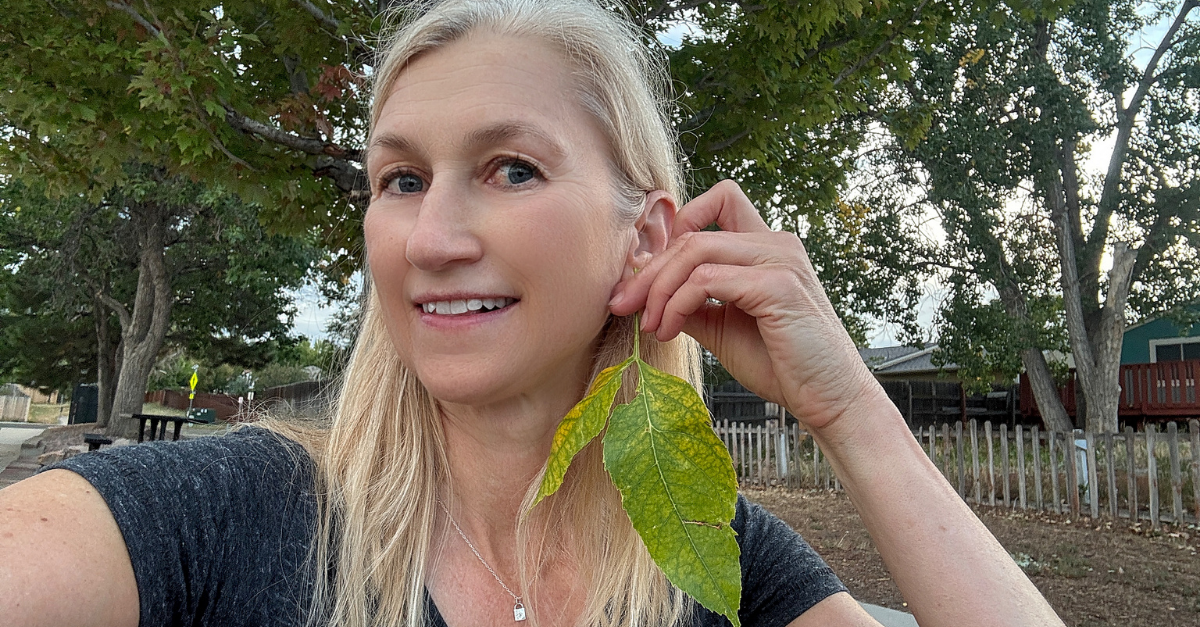 kim byrne wearing scrub oak leaf earrings